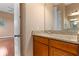 Bathroom featuring a sink with granite countertops and wooden cabinets at 36813 Barrington Dr, Eustis, FL 32736