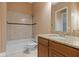 Bathroom showcasing a shower-tub combo, matching tile, and granite vanity at 36813 Barrington Dr, Eustis, FL 32736