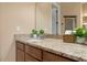 Bathroom with granite countertop, vanity and decorative elements offering a touch of elegance at 36813 Barrington Dr, Eustis, FL 32736