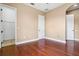 Bedroom with hardwood flooring, neutral walls, and plenty of natural light, ready for personalization at 36813 Barrington Dr, Eustis, FL 32736
