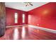 Elegant bedroom with hardwood floors and natural light shining through the arched windows at 36813 Barrington Dr, Eustis, FL 32736