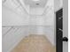 Spacious walk-in closet with built-in shelving and ample storage space for an organized wardrobe at 36813 Barrington Dr, Eustis, FL 32736