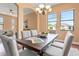 Inviting dining area featuring a wood table, comfortable seating, and ample natural light from nearby windows at 36813 Barrington Dr, Eustis, FL 32736