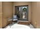 Charming front entrance featuring a decorative glass door, welcome mat, and a cozy seating arrangement at 36813 Barrington Dr, Eustis, FL 32736