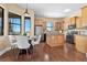 Well-equipped kitchen featuring stainless steel appliances, wooden cabinetry, and breakfast area at 36813 Barrington Dr, Eustis, FL 32736