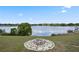 Breathtaking lake view from the backyard with a custom firepit at 36813 Barrington Dr, Eustis, FL 32736