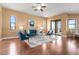 Bright living room with sliding glass doors, offering views and access to outdoor spaces at 36813 Barrington Dr, Eustis, FL 32736