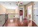 Open living area featuring hardwood floors, view of billiards room and access to an elegant bathroom at 36813 Barrington Dr, Eustis, FL 32736