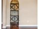Home wine cellar with metal door and wooden shelving at 36813 Barrington Dr, Eustis, FL 32736