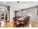 Elegant dining room featuring a hardwood floor, large table with seating for ten, and a built-in china cabinet at 3714 Marigot Way, Clermont, FL 34711