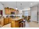Spacious kitchen featuring granite countertops, stainless steel appliances, and a central island with bar seating at 3714 Marigot Way, Clermont, FL 34711