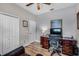 Functional home office with a wood desk, office chair, and ample storage space, plus natural light at 3714 Marigot Way, Clermont, FL 34711