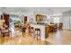 Inviting open-concept living space connecting the kitchen, living room, and dining area for seamless entertaining at 3714 Marigot Way, Clermont, FL 34711