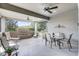 Outdoor patio with a water feature, ceiling fans, and various seating arrangements at 3714 Marigot Way, Clermont, FL 34711