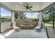 Outdoor patio with a fountain, ceiling fan, and lounge chairs at 3714 Marigot Way, Clermont, FL 34711