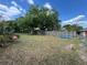 Spacious backyard featuring a grass lawn, wood fence, and plenty of room for outdoor activities at 3845 Sw 148Th Pl, Ocala, FL 34473