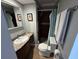 Bathroom features a modern vanity with a granite countertop and step in shower at 3845 Sw 148Th Pl, Ocala, FL 34473