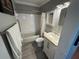 Bathroom with a shower/tub combo, framed mirror, and white vanity, offering a clean design at 3845 Sw 148Th Pl, Ocala, FL 34473