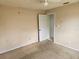 Bedroom showing the walls in need of repair and closet at 4526 Oakton Dr, Orlando, FL 32818