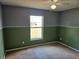 Bedroom showcasing a window, ceiling fan, and two-tone paint scheme at 4526 Oakton Dr, Orlando, FL 32818