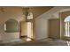 Spacious entryway with high ceilings, arched window, chandelier, and a view of the adjacent rooms at 4526 Oakton Dr, Orlando, FL 32818