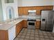 Spacious kitchen with abundant wooden cabinetry, stainless steel appliances, and a convenient breakfast bar at 4526 Oakton Dr, Orlando, FL 32818