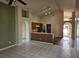 Open floor plan with views of the kitchen, living room, and dining area, enhanced by neutral colors and natural light at 4526 Oakton Dr, Orlando, FL 32818