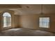 Expansive living room with bright windows and neutral walls, offering a versatile space for any decor at 4526 Oakton Dr, Orlando, FL 32818