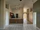 Open-concept living area featuring tile floors, a kitchen bar, and a clear view of the dining area at 4526 Oakton Dr, Orlando, FL 32818