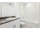 Bright bathroom featuring a single sink, modern vanity, and a shower-tub combo at 4701 Jasmine Cir, Leesburg, FL 34748