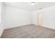 The bedroom features neutral walls, carpet, and an entrance to another room at 4701 Jasmine Cir, Leesburg, FL 34748