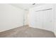 The bedroom features neutral walls, carpet, and a closet for storage at 4701 Jasmine Cir, Leesburg, FL 34748