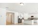 Bright and modern kitchen with white cabinets, stainless steel appliances, and spacious layout at 4701 Jasmine Cir, Leesburg, FL 34748