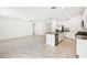 Open-concept kitchen with an island, stainless steel appliances, and ample counter space at 4701 Jasmine Cir, Leesburg, FL 34748