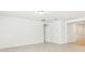 This spacious living room showcases tile floors, light walls, and modern lighting at 4701 Jasmine Cir, Leesburg, FL 34748