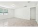 The living room offers tile floors, neutral walls, and a bright, open space at 4701 Jasmine Cir, Leesburg, FL 34748