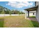 Large backyard featuring a white fence, offering privacy and ample space at 4705 Jasmine Cir, Leesburg, FL 34748