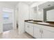 En-suite bathroom boasts double sinks, lots of storage, and tile floor at 4705 Jasmine Cir, Leesburg, FL 34748