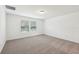 Spacious bedroom with two large windows providing natural light at 4705 Jasmine Cir, Leesburg, FL 34748