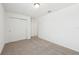 This cozy bedroom offers ample closet space and neutral carpeting at 4705 Jasmine Cir, Leesburg, FL 34748