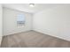 A bedroom with carpet floors and a window to the outside at 4705 Jasmine Cir, Leesburg, FL 34748
