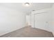 A bright bedroom featuring carpet floors and a closet with paneled doors at 4705 Jasmine Cir, Leesburg, FL 34748