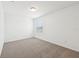 Bright bedroom features neutral carpeting and a single window for natural light at 4705 Jasmine Cir, Leesburg, FL 34748