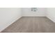 Bright bedroom featuring neutral carpeting and a single window for natural light at 4705 Jasmine Cir, Leesburg, FL 34748