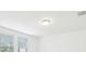 Clean ceiling showing minimalist ceiling light and windows at 4705 Jasmine Cir, Leesburg, FL 34748