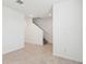 Tile flooring hallway with stairs leading to the second floor at 4705 Jasmine Cir, Leesburg, FL 34748