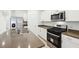 The kitchen offers an island and stainless steel appliances at 4705 Jasmine Cir, Leesburg, FL 34748