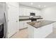 The well-equipped kitchen features stainless steel appliances and a large island at 4705 Jasmine Cir, Leesburg, FL 34748