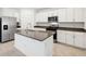 Stylish kitchen features an island, stainless steel appliances, and modern finishes at 4705 Jasmine Cir, Leesburg, FL 34748