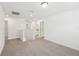 Upstairs loft area features carpet, multiple doorways, and plenty of open space at 4705 Jasmine Cir, Leesburg, FL 34748
